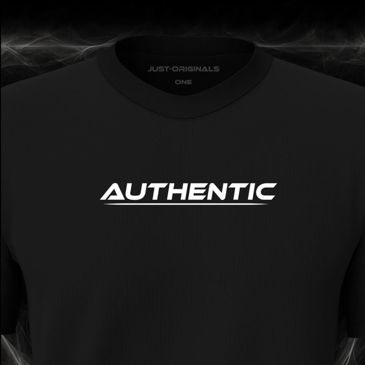 Close-up of the JUST-ORIGINALS™ LIFESTYLE ONE Unisex AUTHENTIC I design on a BlackPulse™ premium black t-shirt, featuring white AUTHENTIC typography, a white underline, and premium neck label.