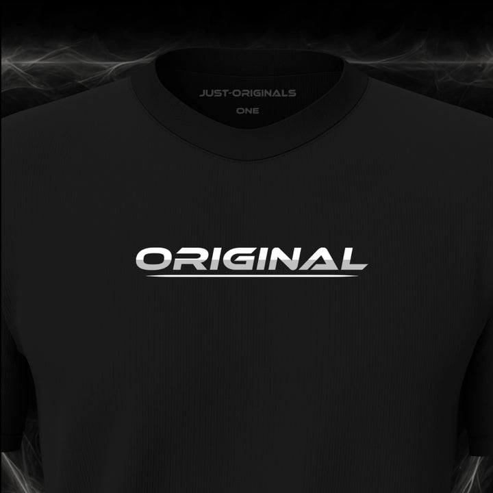 JUST-ORIGINALS™ LIFESTYLE ONE Unisex Tee — ORIGINAL II design close-up on BlackPulse™ premium fabric featuring white typography with silver-gray lower accent and white underline.