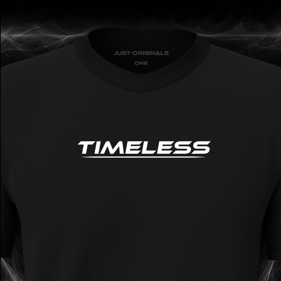Close-up of the JUST-ORIGINALS™ LIFESTYLE ONE Unisex TIMELESS I design on a BlackPulse™ premium black t-shirt, featuring white TIMELESS typography, white underline, and premium neck label.