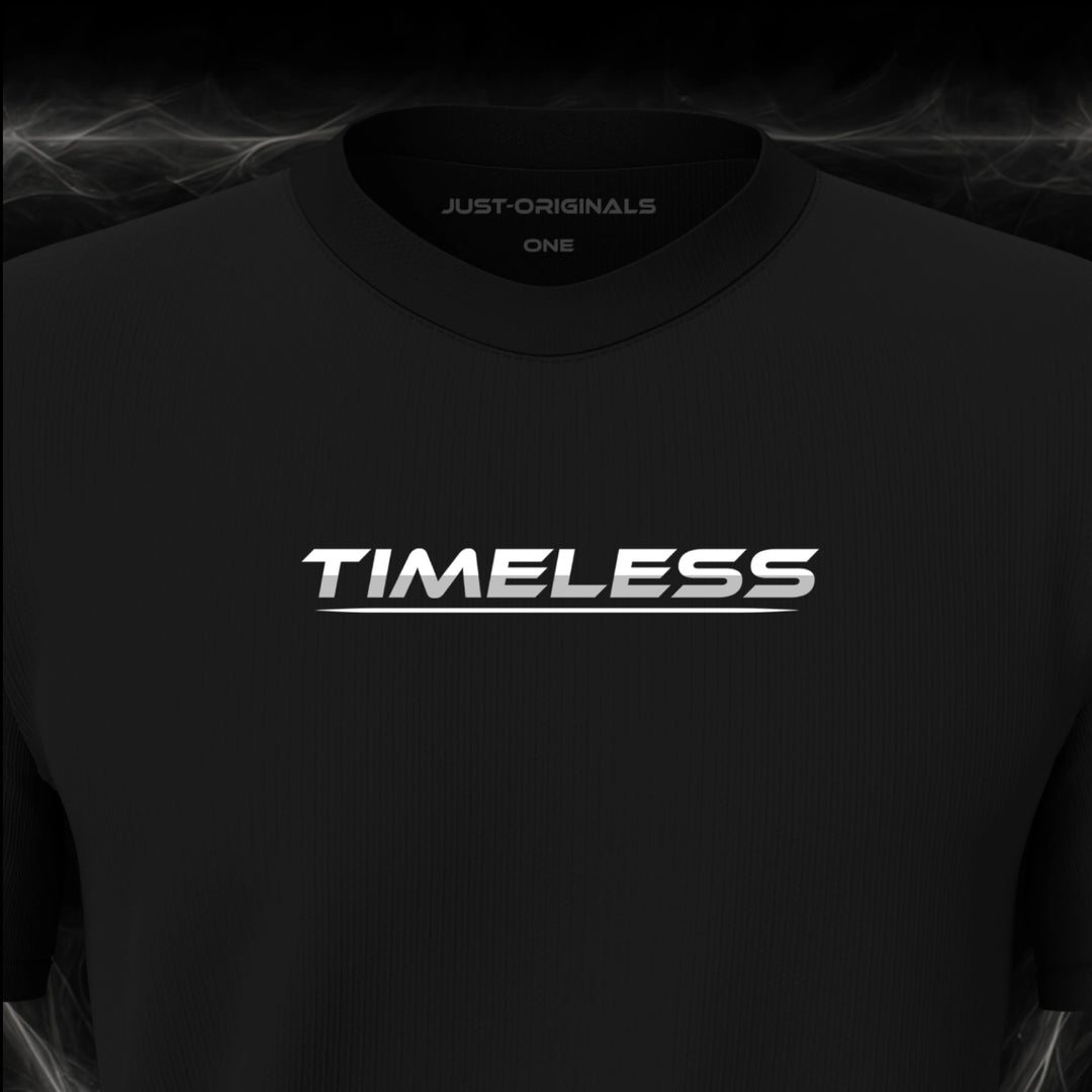Close-up of the JUST-ORIGINALS™ LIFESTYLE ONE Unisex TIMELESS II design on a BlackPulse™ premium black t-shirt, featuring white TIMELESS typography with silver-gray accent, white underline, and premium neck label.