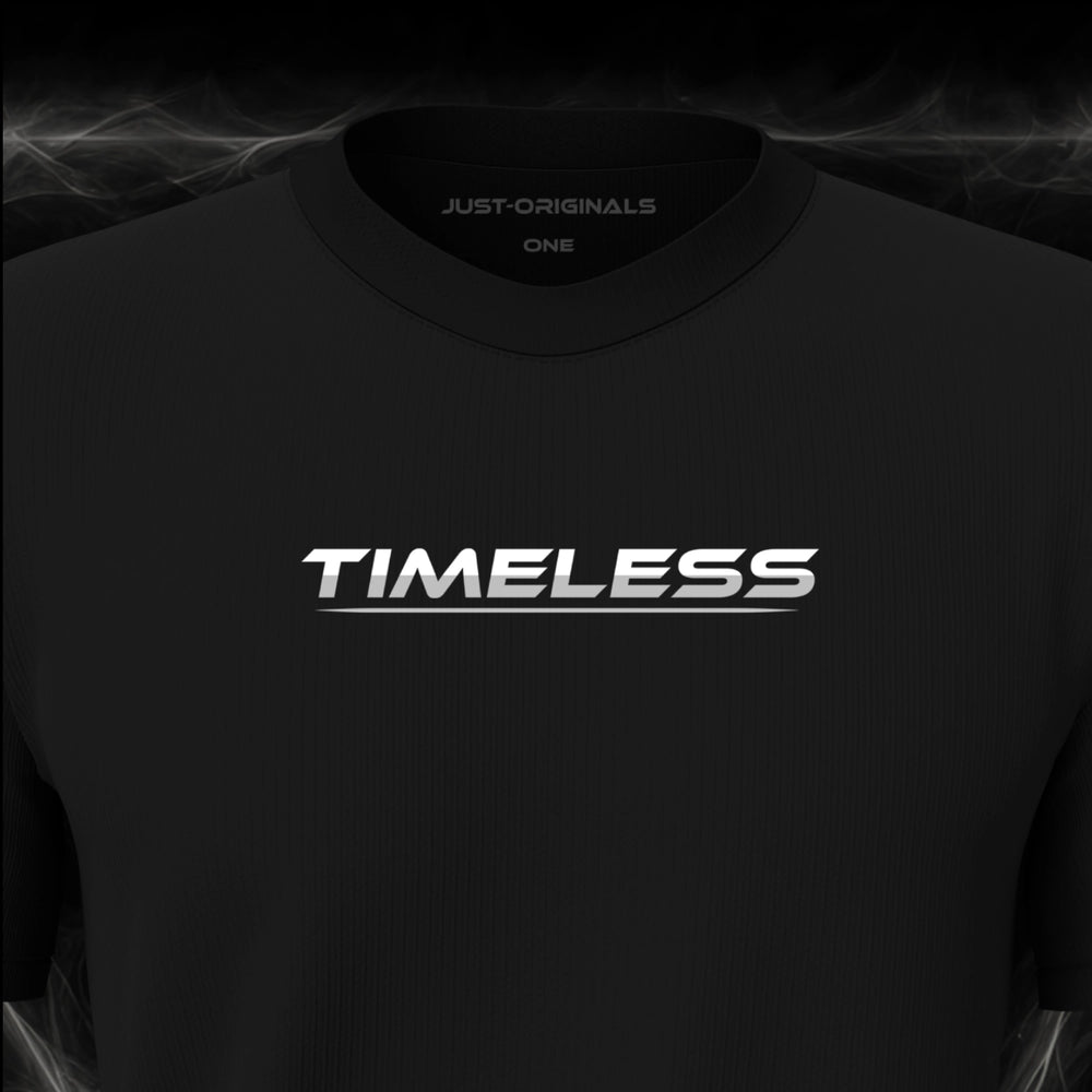 Close-up of the JUST-ORIGINALS™ LIFESTYLE ONE Unisex TIMELESS III design on a BlackPulse™ premium black t-shirt, featuring white TIMELESS typography with silver-gray accent, silver-gray underline, and premium neck label.