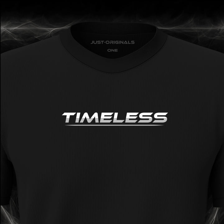 Close-up of the JUST-ORIGINALS™ LIFESTYLE ONE Unisex TIMELESS III design on a BlackPulse™ premium black t-shirt, featuring white TIMELESS typography with silver-gray accent, silver-gray underline, and premium neck label.