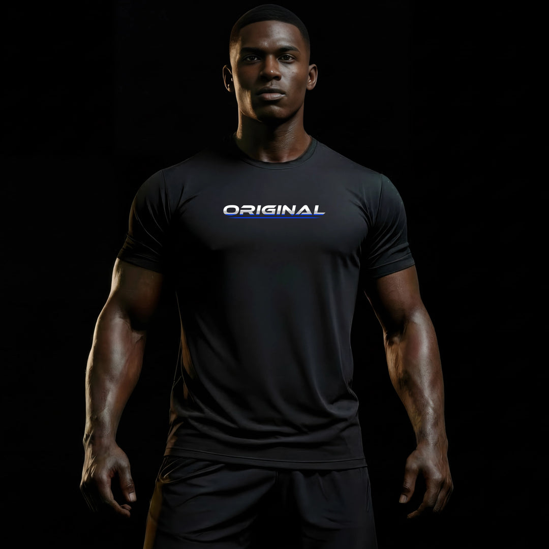 LIFESTYLE PRIME Unisex Tee by JUST-ORIGINALS™ featuring the ORIGINAL design on BlackPulse™ colorway worn by a male model against a black premium background.
