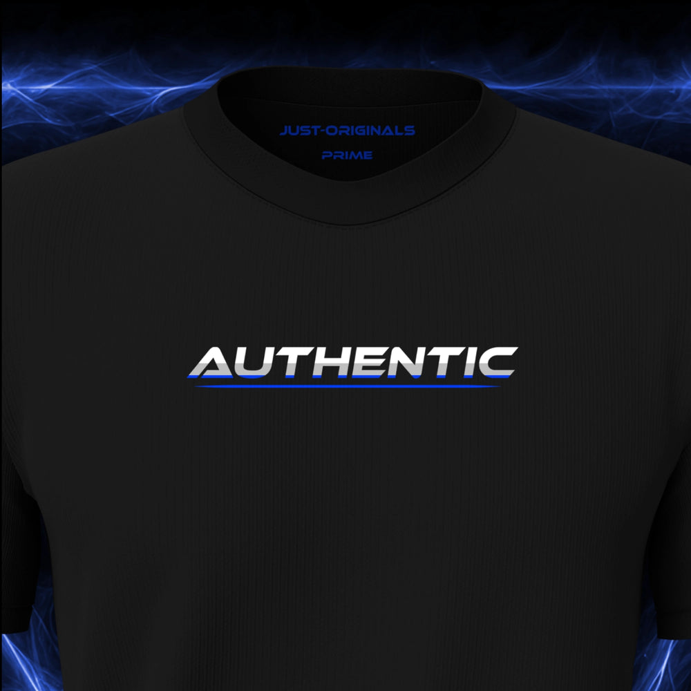 Close-up of the JUST-ORIGINALS™ LIFESTYLE PRIME Unisex AUTHENTIC III design on a BlackPulse™ premium black t-shirt, featuring white AUTHENTIC typography with silver-gray accents, blue lower accents, a blue underline, and premium neck label.