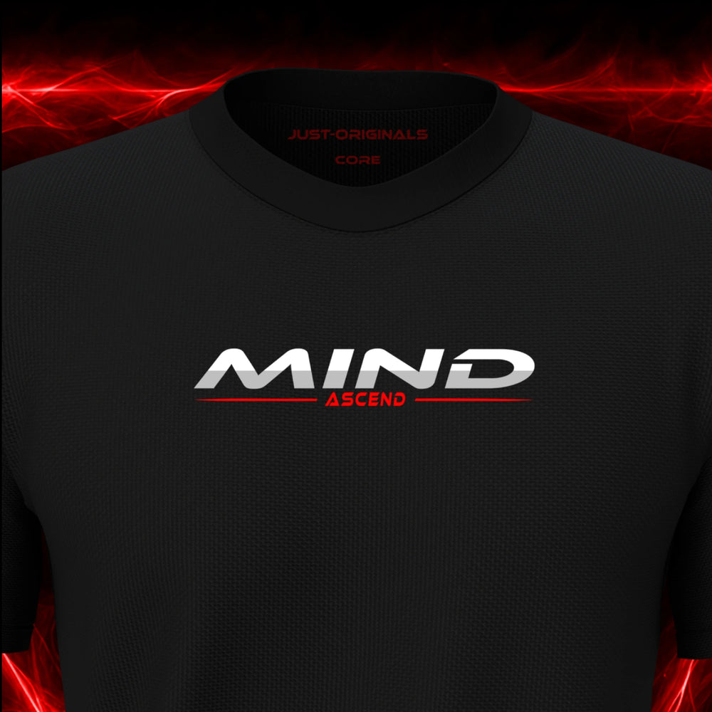 Close-up of the JUST-ORIGINALS™ MAXPULSE CORE Men MIND ASCEND design on a BlackPulse™ performance t-shirt, featuring white MIND typography, red ASCEND text, a red center accent line, and premium neck label.