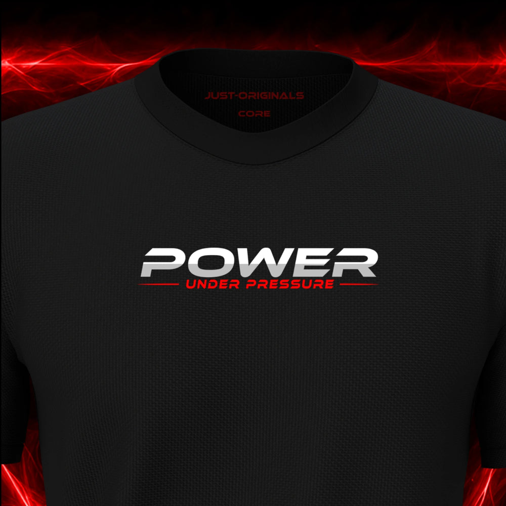 Close-up of the JUST-ORIGINALS™ MAXPULSE™ CORE Men POWER UNDER PRESSURE design on a BlackPulse™ performance t-shirt, featuring white POWER typography, red UNDER PRESSURE text, a red center accent line, and premium neck label.