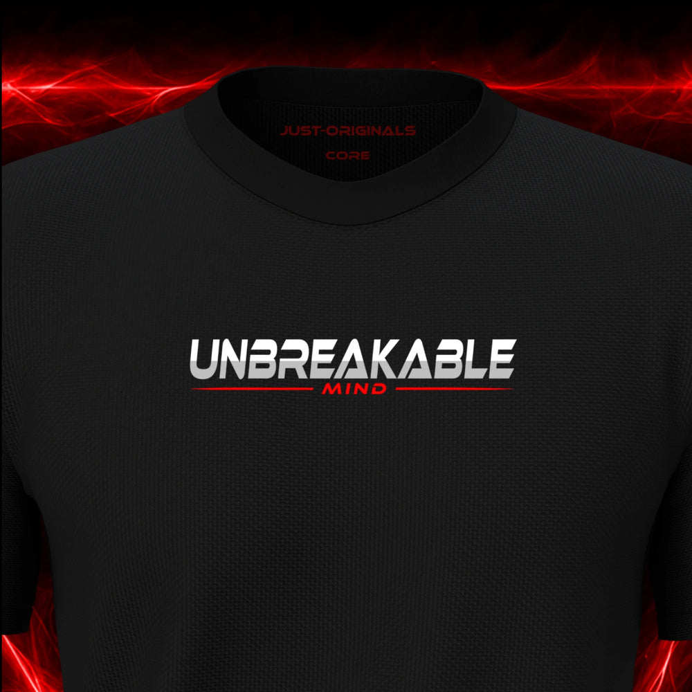 Close-up of the JUST-ORIGINALS™ MAXPULSE™ CORE Men UNBREAKABLE MIND design on a BlackPulse™ performance t-shirt, featuring white UNBREAKABLE typography, red MIND text, a red center accent line, and premium neck label.