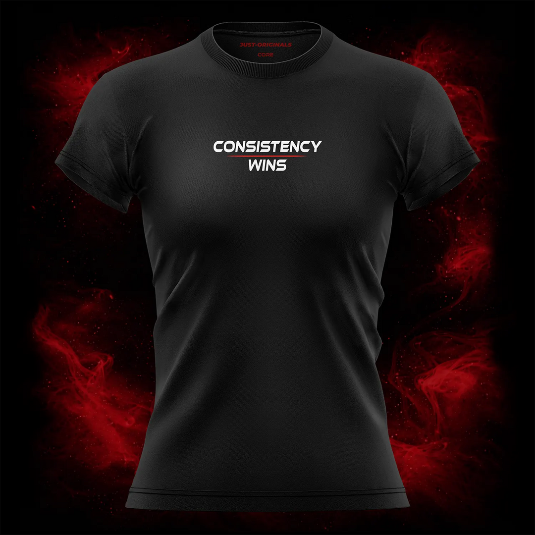 MAXPULSE™ CORE Women Tee featuring CONSISTENCY WINS centered on BlackPulse™ performance fabric with clean athletic typography and red accent line, built for disciplined training and everyday performance.