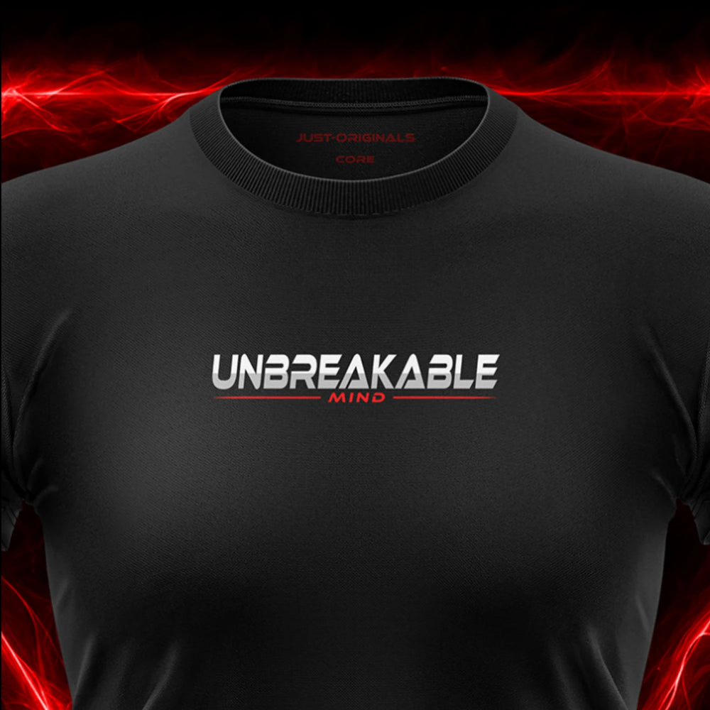 Close-up of the JUST-ORIGINALS™ MAXPULSE™ CORE Women UNBREAKABLE MIND design on a BlackPulse™ performance t-shirt, featuring white and silver UNBREAKABLE typography, red MIND text, red accent line, red premium neck label, and premium athletic fabric.
