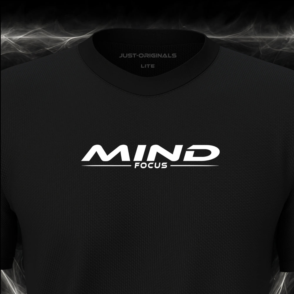 Close-up of the JUST-ORIGINALS™ MAXPULSE™ LITE Men MIND FOCUS design on a BlackPulse™ performance t-shirt, featuring white MIND typography, white FOCUS text, a white underline, and premium neck label.