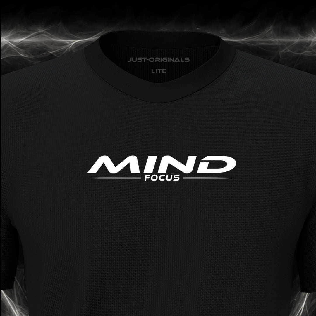 Close-up of the JUST-ORIGINALS™ MAXPULSE™ LITE Men MIND FOCUS design on a BlackPulse™ performance t-shirt, featuring white MIND typography, white FOCUS text, a white underline, and premium neck label.