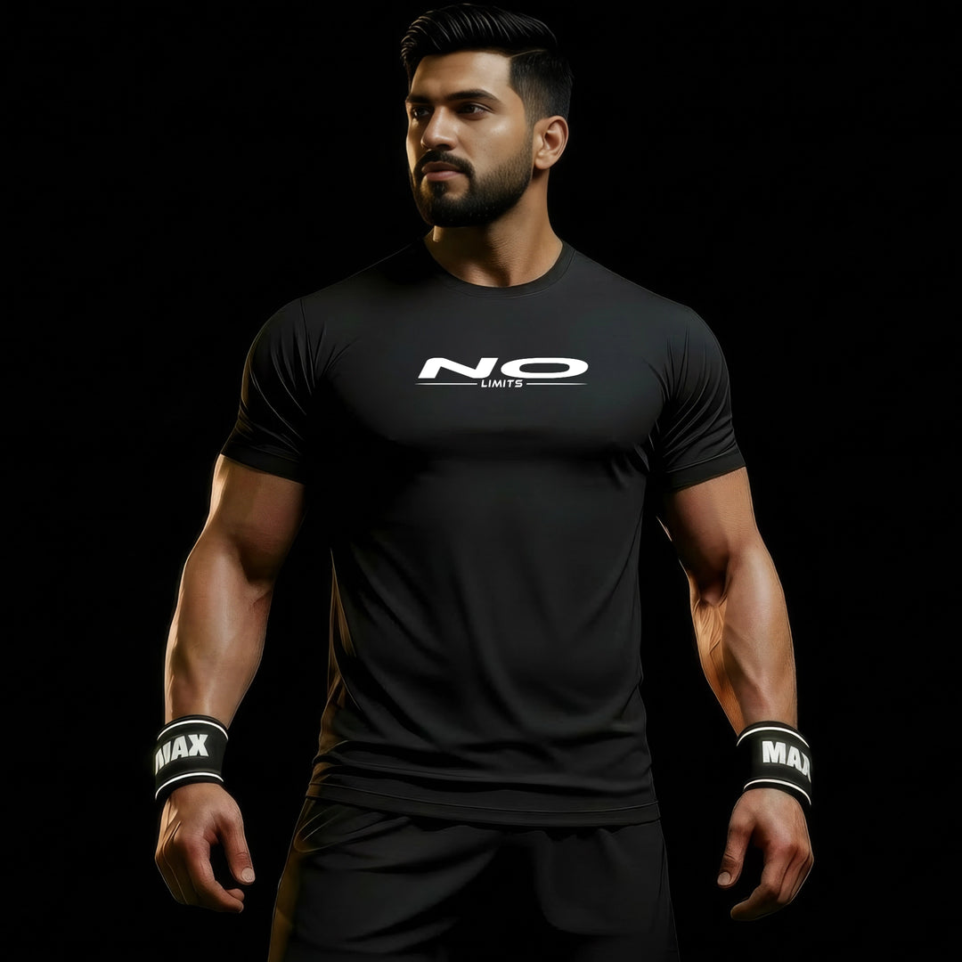 MAXPULSE™ LITE Men | NO LIMITS | BlackPulse™ performance tee | Side model view showing lightweight breathable fit with minimal chest print | Male fitness model looking to the side with strong posture in dark studio setting | Featured in MAXPULSE™ LITE Men Tee