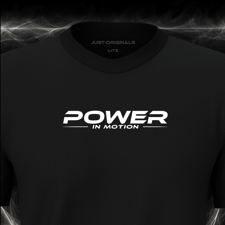 Close-up of the JUST-ORIGINALS™ MAXPULSE™ LITE Men POWER IN MOTION design on a BlackPulse™ performance t-shirt, featuring white POWER typography, white IN MOTION text, a white underline, and premium neck label.
