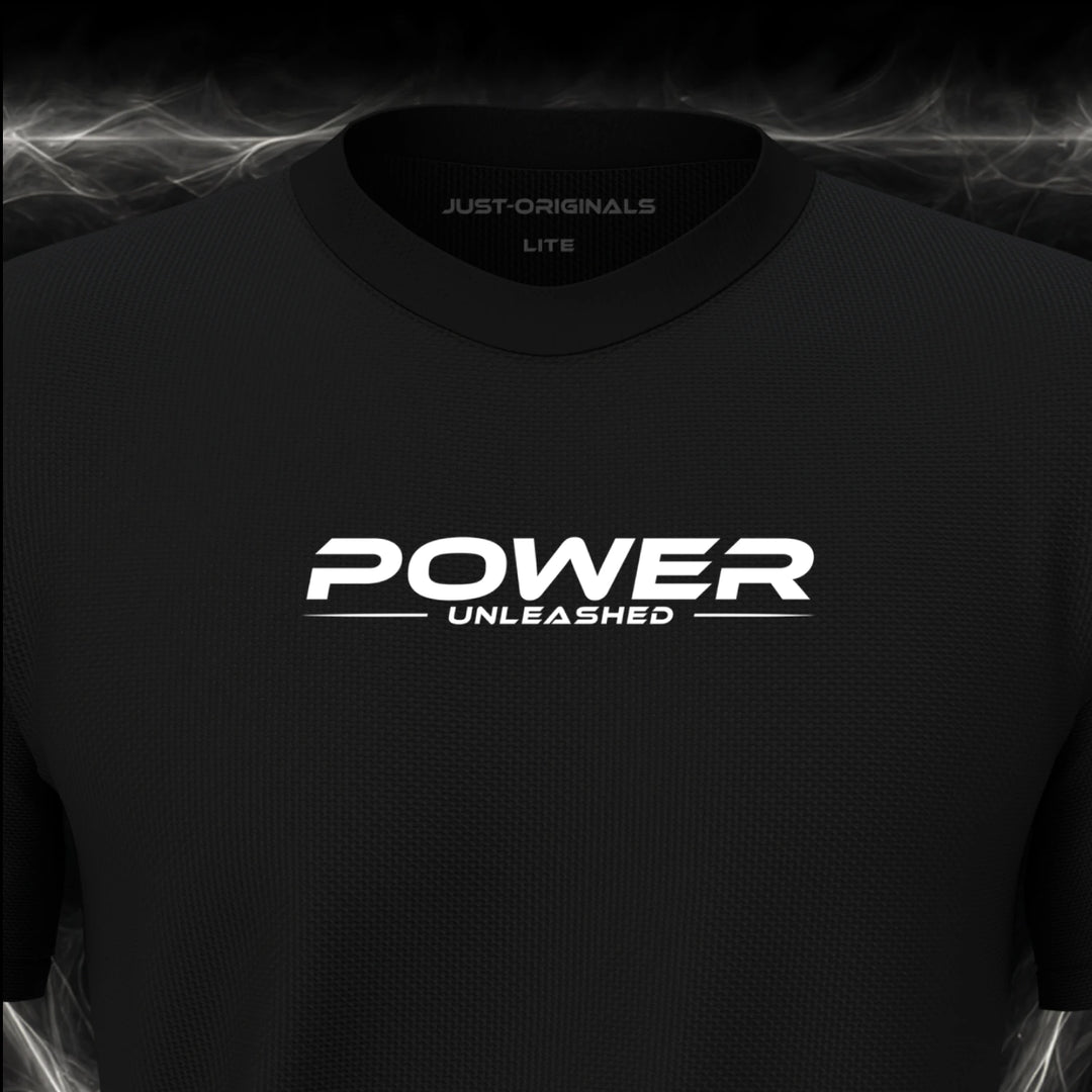 Close-up of the JUST-ORIGINALS™ MAXPULSE™ LITE Men POWER UNLEASHED design on a BlackPulse™ performance t-shirt, featuring white POWER typography, white UNLEASHED text, a white underline, and premium neck label.