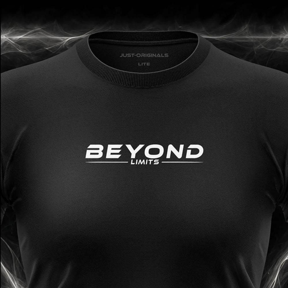 Close-up of the JUST-ORIGINALS™ MAXPULSE LITE Women BEYOND LIMITS design on a BlackPulse™ performance t-shirt, featuring white BEYOND typography, white LIMITS text, white accent line, and premium neck label.