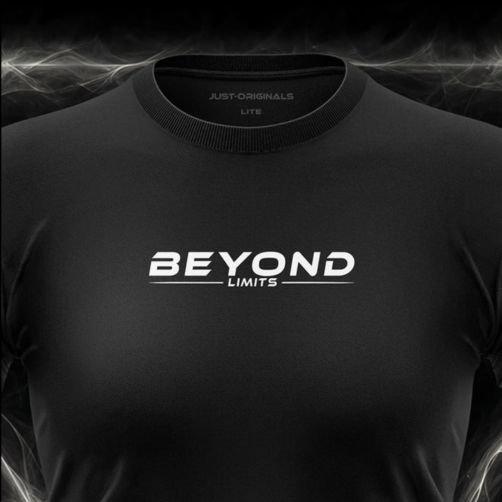 Close-up of the JUST-ORIGINALS™ MAXPULSE LITE Women BEYOND LIMITS design on a BlackPulse™ performance t-shirt, featuring white BEYOND typography, white LIMITS text, white accent line, and premium neck label.