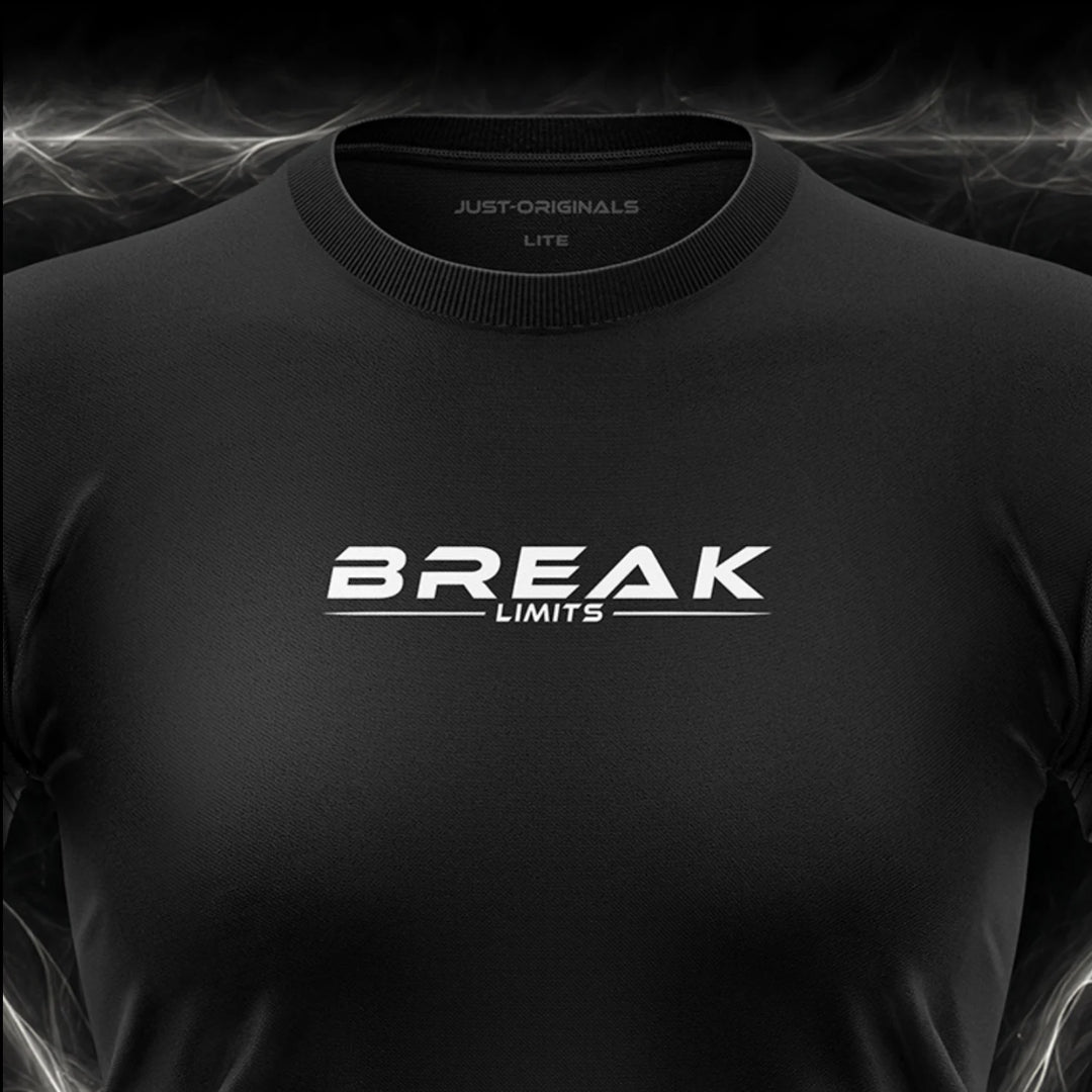 Close-up of the JUST-ORIGINALS™ MAXPULSE LITE Women BREAK LIMITS design on a BlackPulse™ performance t-shirt, featuring white BREAK typography, white LIMITS text, white accent line, and premium neck label.