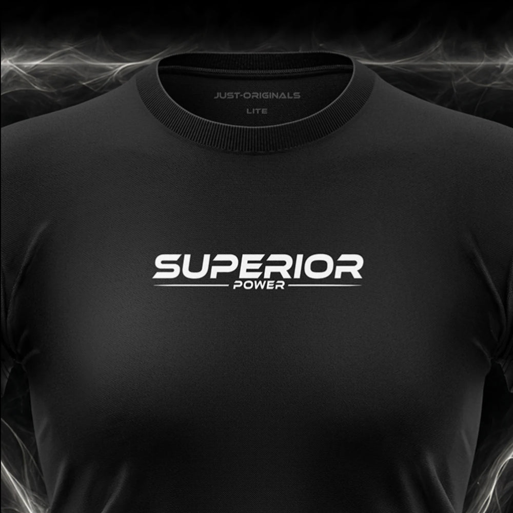 Close-up of the JUST-ORIGINALS™ MAXPULSE™ LITE Women SUPERIOR POWER design on a BlackPulse™ performance t-shirt, featuring white and silver SUPERIOR typography, white POWER text, white accent line, silver premium neck label, and premium athletic fabric.