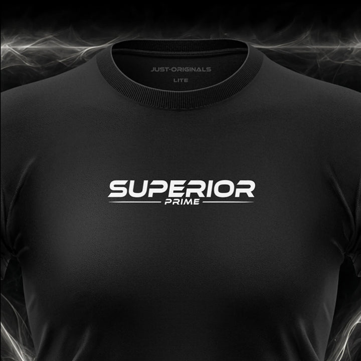 Close-up of the JUST-ORIGINALS™ MAXPULSE™ LITE Women SUPERIOR PRIME design on a BlackPulse™ performance t-shirt, featuring white and silver SUPERIOR typography, white PRIME text, white accent line, silver premium neck label, and premium athletic fabric.