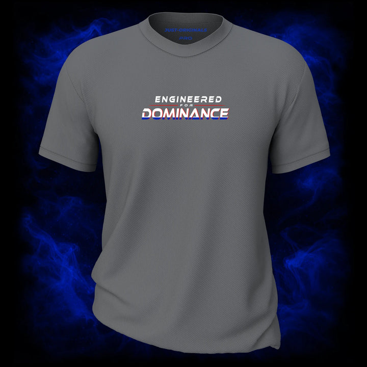 MAXPULSE™ PRO Men Tee featuring ENGINEERED FOR DOMINANCE centered on SteelPulse™ performance fabric with bold red and blue typographic contrast, engineered for strength, precision, and elite performance.