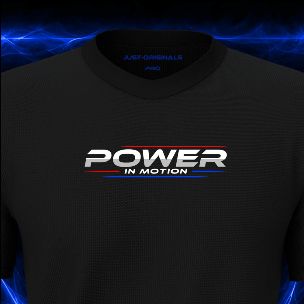 Close-up of the JUST-ORIGINALS™ MAXPULSE PRO Men POWER IN MOTION design on a BlackPulse™ performance t-shirt, featuring white POWER typography, white IN MOTION text, red and blue performance accent lines, and premium neck label.