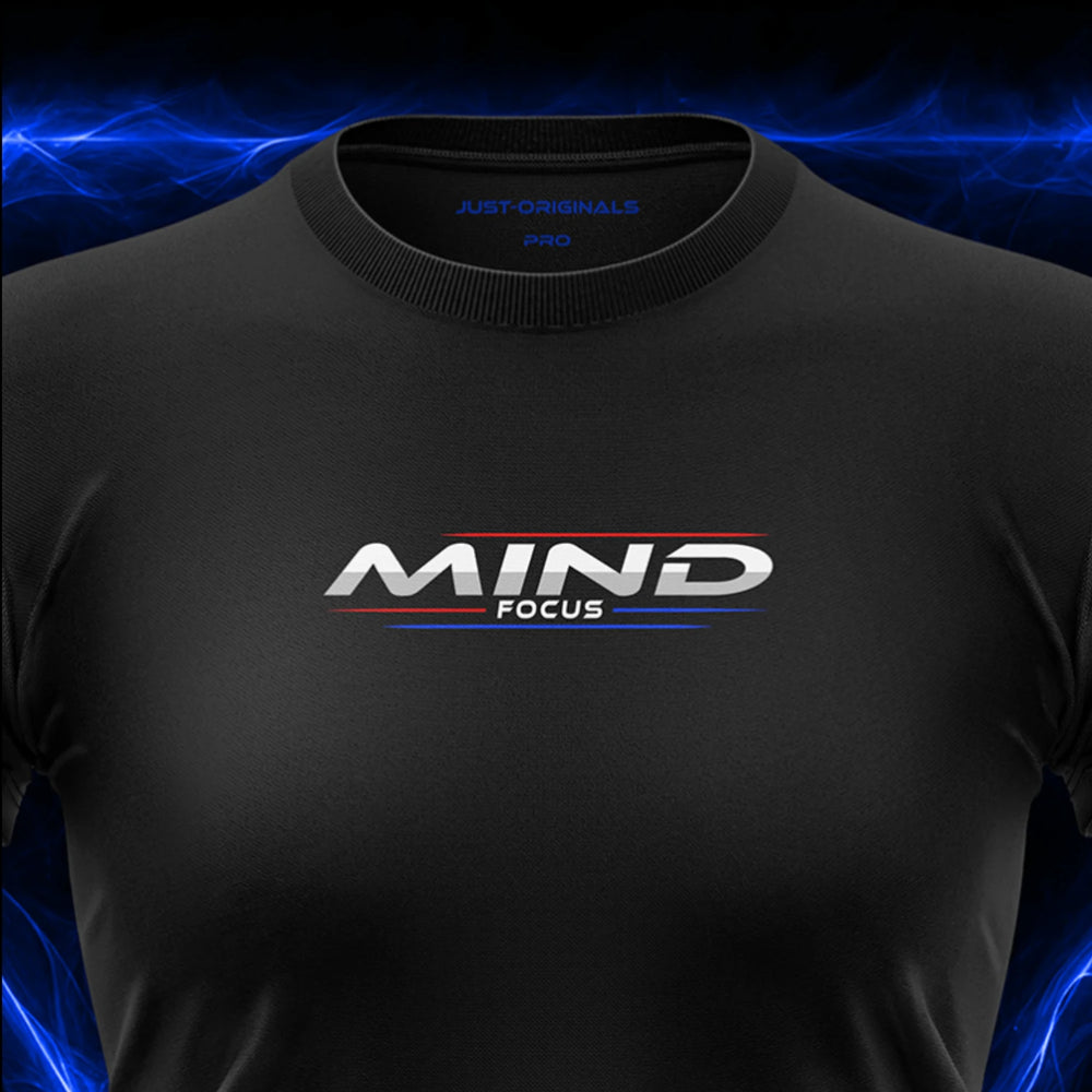 Close-up of the JUST-ORIGINALS™ MAXPULSE™ PRO Women MIND FOCUS design on a BlackPulse™ performance t-shirt, featuring white and silver MIND typography, white FOCUS text, red and blue accent lines, blue premium neck label, and premium athletic fabric.