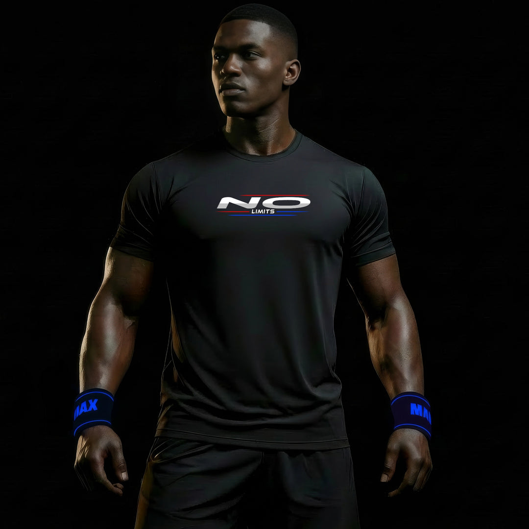 MAXPULSE™ PRO | NO LIMITS | Men Performance Tee | BlackPulse™ premium black athletic shirt with NO LIMITS chest print and blue/red accent lines | Male fitness model looking to the side with strong posture and defined physique in dark studio lighting | Featured in MAXPULSE™ PRO Men Tee