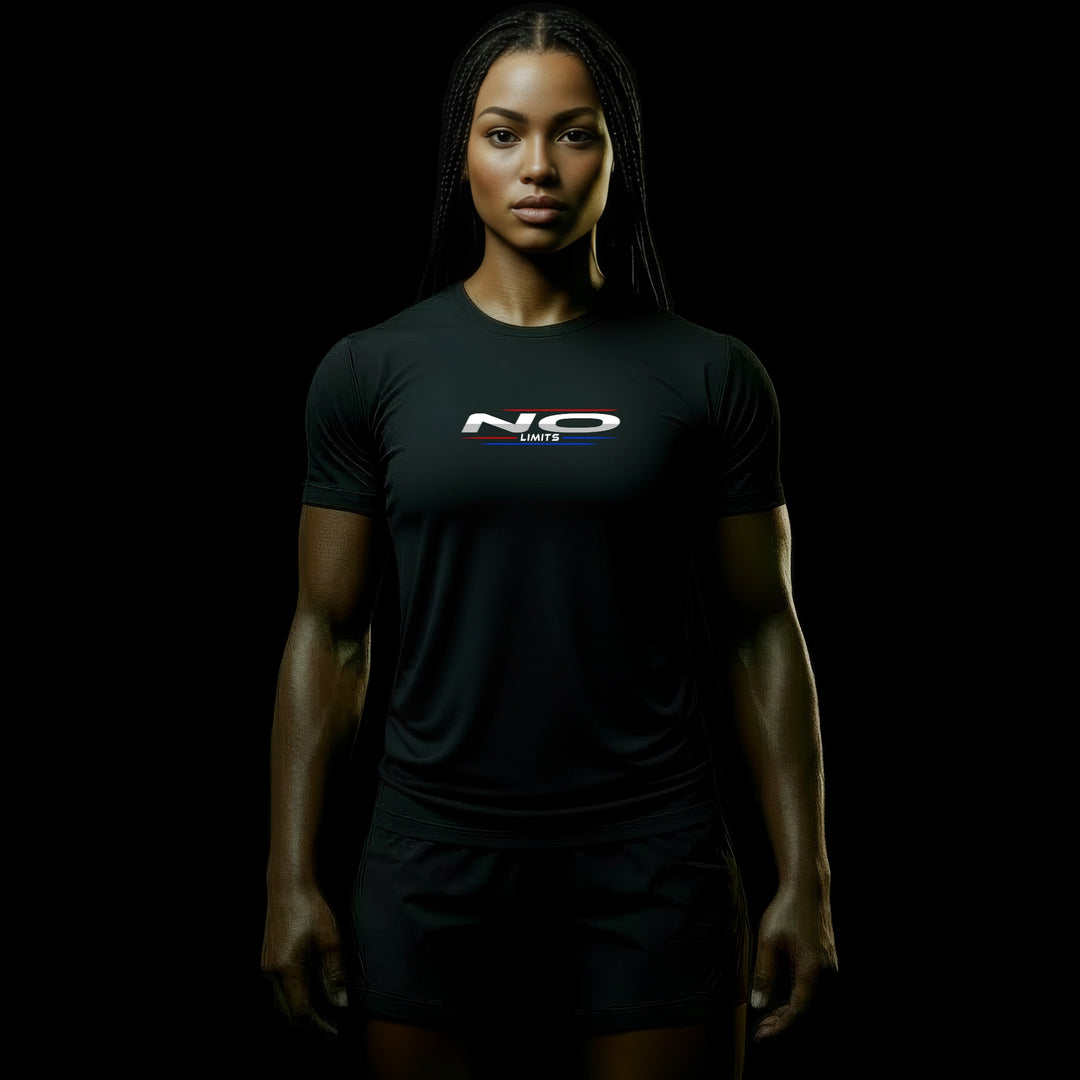 MAXPULSE™ PRO | NO LIMITS | Women Performance Tee | BlackPulse™ premium black athletic shirt with NO LIMITS chest print and blue/red accent lines | Female fitness model front-facing with powerful stance and defined build in minimal dark studio setting | Featured in MAXPULSE™ PRO Women Tee
